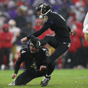 Tucker launches the kick that sealed the win for the Ravens.