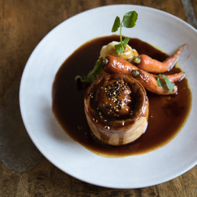 The steak and Guinness pie with mashed potato and honeyed baby carrots.