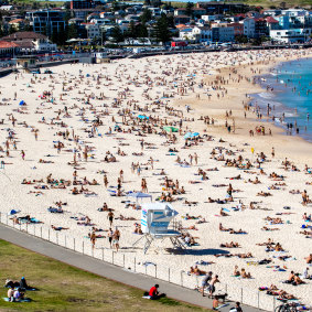 Bondi Beach was packed in September during lockdown, while western Sydney had curfews. 