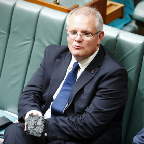Then-treasurer Scott Morrison holding a piece of coal in question time last year as part of a show of support for the industry.
