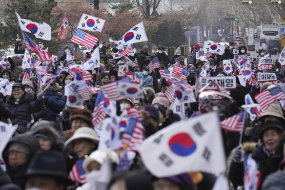 Supporters of impeached South Korean President Yoon Suk Yeol shout slogans during a rally to oppose his impeachment near the Constitutional Court in Seoul on Tuesday.