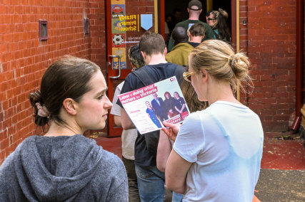 Residents cast their votes on polling day at the Fitzroy Primary School.