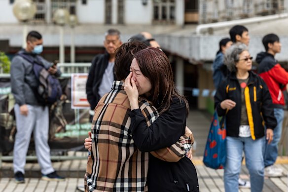 A woman cries near the scene in Hong Kong.