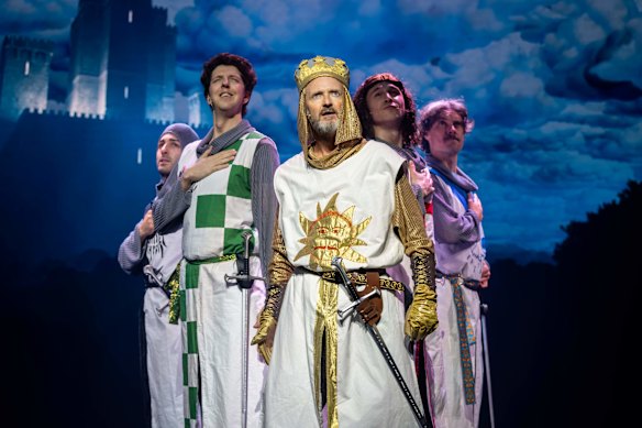 Stephen Curry as King Arthur with the cast in a scene from Spamalot. 