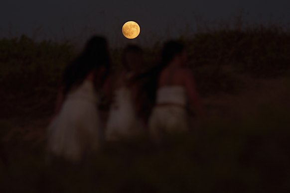 A blood moon rises ahead of a Lunar Eclipse in Hadera, Israel, in September.