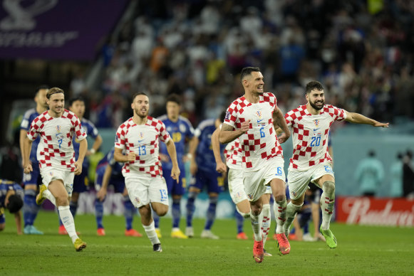 Croatian players celebrate after defeating Japan.
