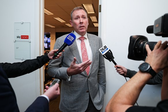 Liberal MP Garth Hamilton speaks to the media after question time.