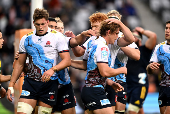 The Waratahs celebrate a try in their win over the Highlanders in Dunedin.