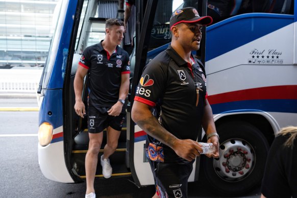 Latrell Mitchell, right, and Jack Wighton leave the Indigenous All Stars team bus together.