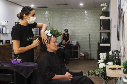 Joanne Sultana works on Sonia Korthout at Union Jacks Hair salon in Frenchs Forest on Wednesday.