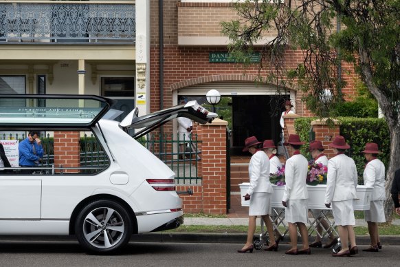 Lilie James’ coffin arrives at her funeral. 