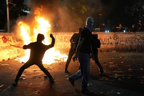 Jakarta protesters threw stones at police during a rally in February.