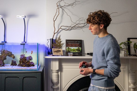 Charlie Brookman with one of the aquascapes he designed and constructed. 