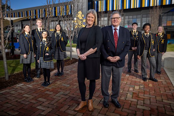 Bacchus Marsh Grammar principal Debra Ogston (L) and CEO Andrew Neal, with students Emma Stewart, Roshyna Attwal, Samuel Lillie, Keisha Tau, Lucas Harper, Awande Masuku and Madelyn Hunter.