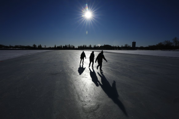 Skater brave the cold to lace up the blades on opening day of the Rideau Canal Skateway in Ottawa, Ontario.