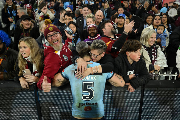 Zac Lomax with his mum after Origin II at the MCG.