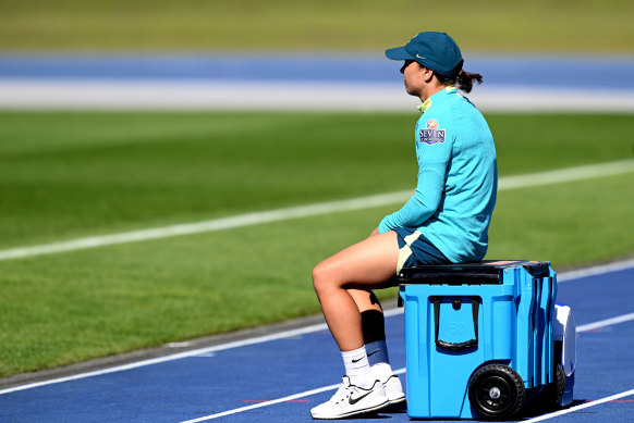 Sam Kerr watches Matildas training on an Esky at the Queensland Sport and Athletics Centre on Sunday.