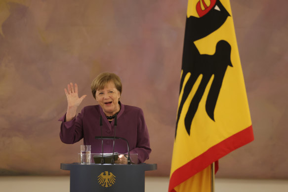 Former German chancellor Angela Merkel speaks after she received the Order of Merit of the Federal Republic of Germany (Verdienstorden der Bundesrepublik Deutschland) from President Frank-Walter Steinmeier.