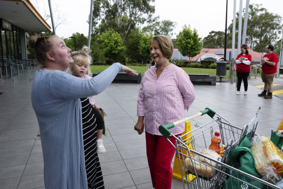 Labor candidate Karen McKeown campaigns outside Cranebrook Shopping Village.