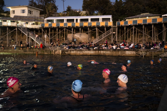 Swimmers celebrate the onset of the winter solstice with a dawn dip at Wylie’s Baths.