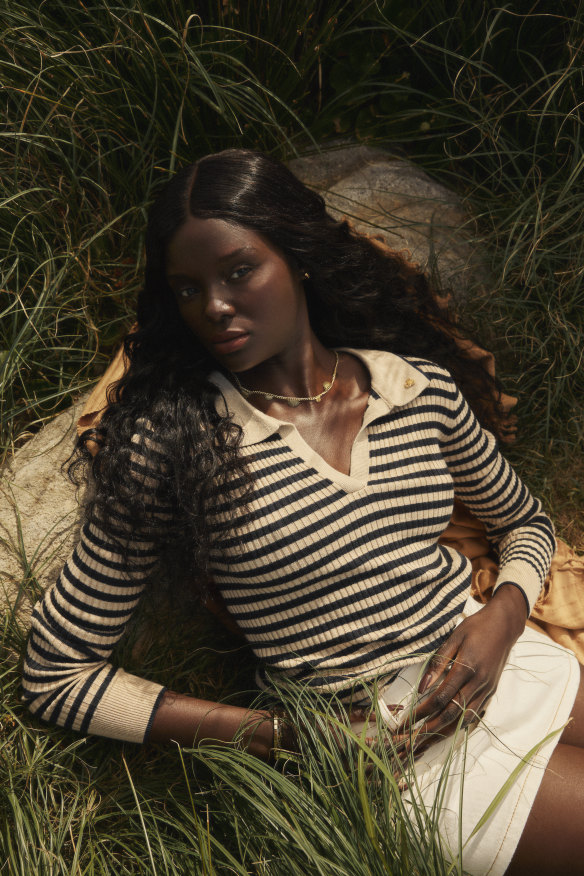 Scotch & Soda polo shirt, $200. Camilla and Marc “Limia” skirt, $250, from The Iconic. Turkish Murkish “Stonewashed” towel, $90. Arms of Eve “Harper” ring, 
$69, from The Iconic.