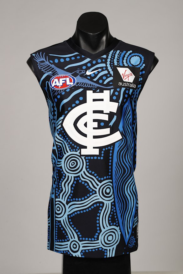 The navy blue is imprinted with symbols that celebrate values such as family, strength and protection.