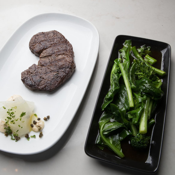 The dry-aged Porterhouse and stir-fried greens.