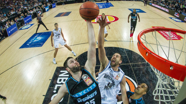 Alex Pledger of the Breakers is challenged by Tom Jervis of the Bullets in their round 7 NBL basketball match in Auckland on Sunday.