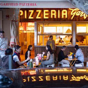 Footpath seating makes up most of the dining real estate at Garfield Pizzeria on Lygon Street.