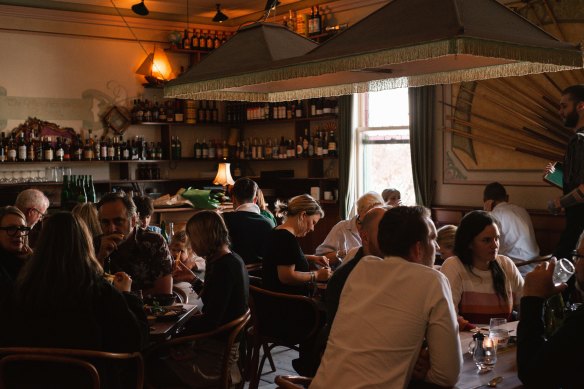 The firelit dining space of Neighbourhood Wine.
