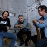Ewan Leslie (left) Brendan Cowell (centre) and Toby Schmitz (right) at Carriageworks where they will perform their show ‘Hamlet Camp’ they are currently writing. Eveleigh, NSW. December 4, 2024. Photo: Kate Geraghty