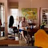 Peter Frith in his dining room, surrounded by eclectic objects. The willow pendant light is by Annemarie O’Sullivan of Studio Amos. The painting is by Alan Warren.