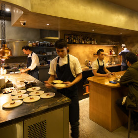 The chefs deliver and describe dishes.