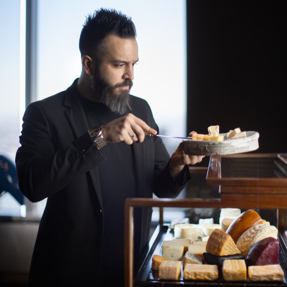 Rajnor Soin pictured with the all-Australian cheese trolley at Vue de Monde.