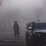 Crown prosecutor Dr Nanette Rogers, SC, cuts a solemn figure in the heavy fog and freezing temperatures as she arrives at court early on Wednesday.