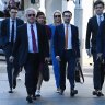 Surgeon Munjed Al Muderis (centre) with his legal team.