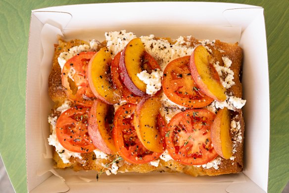 Breakfast focaccia with ricotta, tomatoes and peaches. 