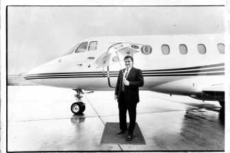 John Elliott with the IXL company jet at Essendon Airport in 1987.