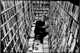 Bob Gould sorts through his large Beta video collection at his premises in King Street, Newtown.