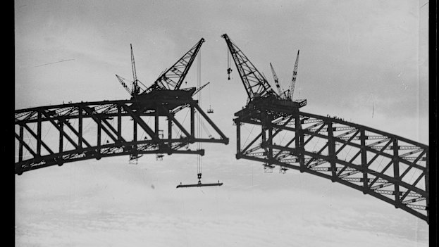 Cranes joining the two halves of the Sydney Harbour Bridge on August 1, 1930. Construction began in July 1923 and the bridge was officially opened in March, 1932.