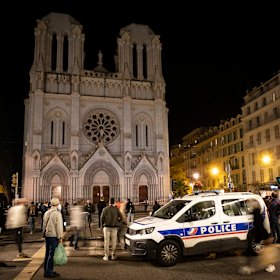 People pay tribute to the victims of last month's terror attack at the Notre Dame Basilica in Nice.
