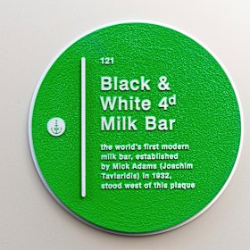 A plaque commemorating the  opening  in 1932 of the world’s first modern milk bar, The Black & White 4D,  on Martin Place, Sydney, was unveiled on Wednesday. 