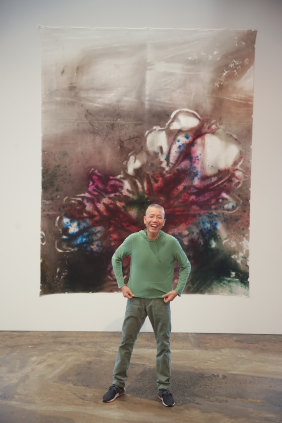 Cai Guo-Qiang with one silk panel, hung shortly after the work was completed.