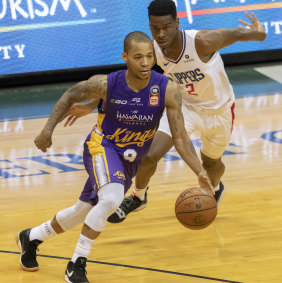 Big test: Sydney Kings guard Jerome Randle drives by Los Angeles Clippers guard Shai Gilgeous-Alexander.