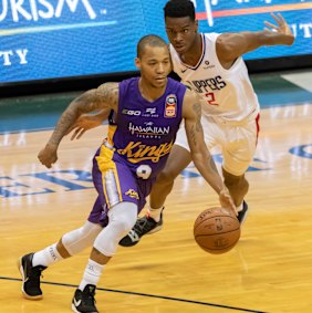 Big test: Sydney Kings guard Jerome Randle drives by Los Angeles Clippers guard Shai Gilgeous-Alexander.