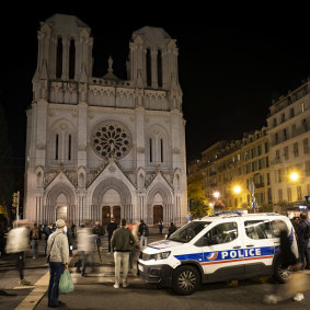 People pay tribute to the victims of last month's terror attack at the Notre Dame Basilica in Nice.