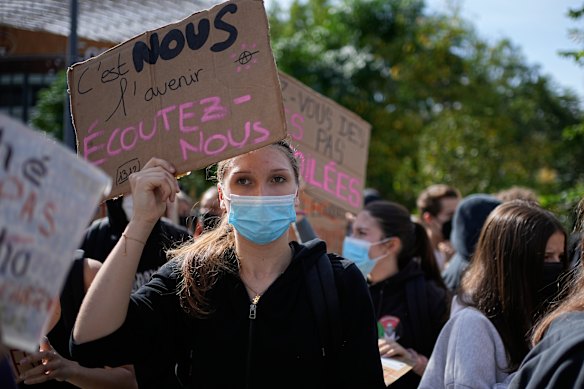 A student holds a board reading “We are the future, listen to us!” during a protest in Lyon, France.