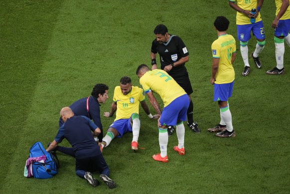 Neymar gets some medical attention in the second half of the Serbia match.