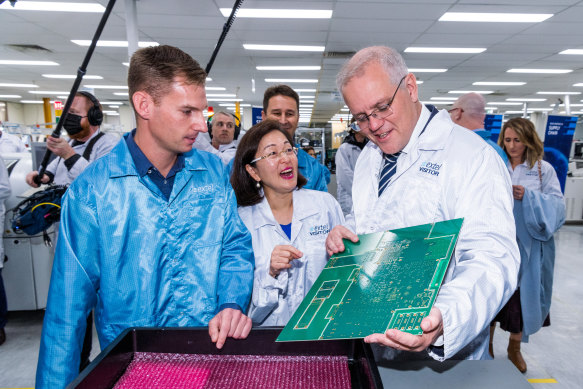 Chisholm MP Gladys Liu with Prime Minister Scott Morrison at Extel Technologies in Melbourne on Friday. 