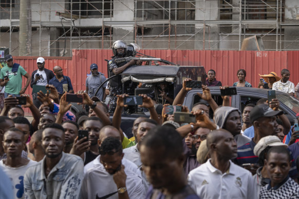 Extra security forces arrive to thwart the risk of an attack on a polling station at which votes were being counted, in Lagos, Nigeria on Saturday.